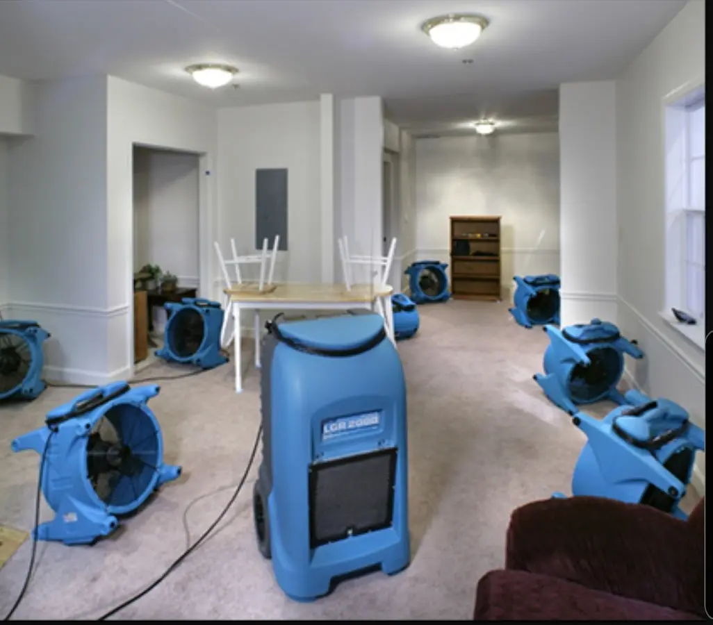 Air movers and dehumidifier setup for Water Damage Restoration in Springville